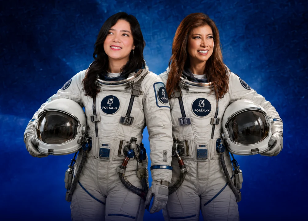 Paula Callejas and Xochitl Palacios, founders of Portal-X, in astronaut suits